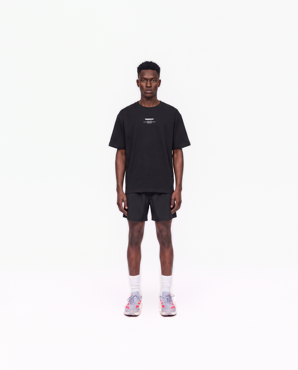 Model wearing the Today Was My Rest Day oversize t-shirt in black — front view with the compact Thundernoise chest mark in white — View 2