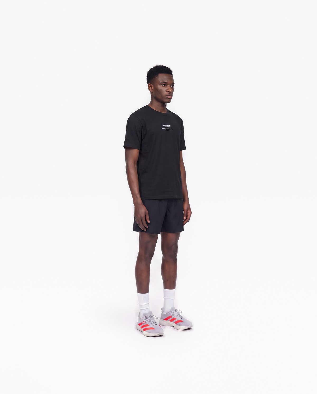 Model wearing the Today Was My Rest Day t-shirt in black — three-quarter view showing the regular fit — View 3