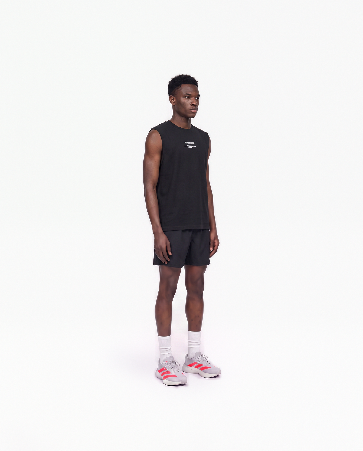 Model wearing the Today Was My Rest Day tank top in black — three-quarter view showing the regular fit — View 3