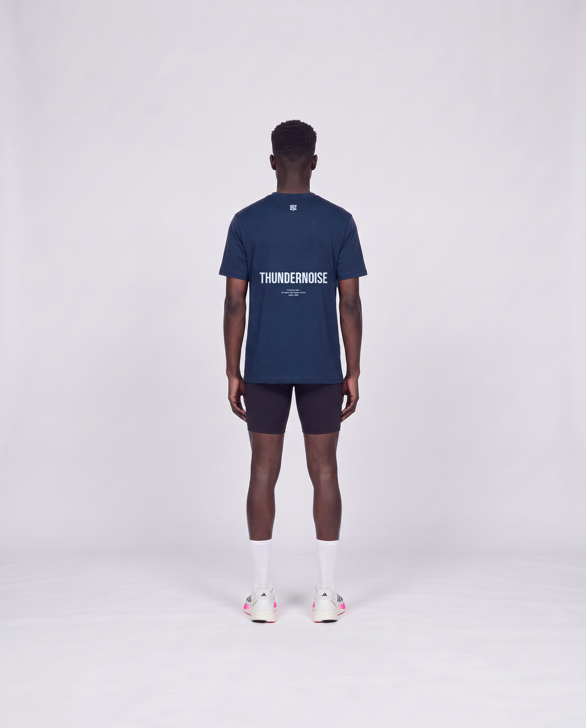Training Dept. triblend t-shirt in french navy heather on model — back view — View 4