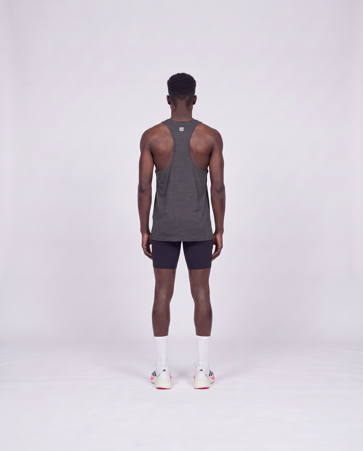Training Dept. triblend tank top in dark grey heather on model — back view — View 4