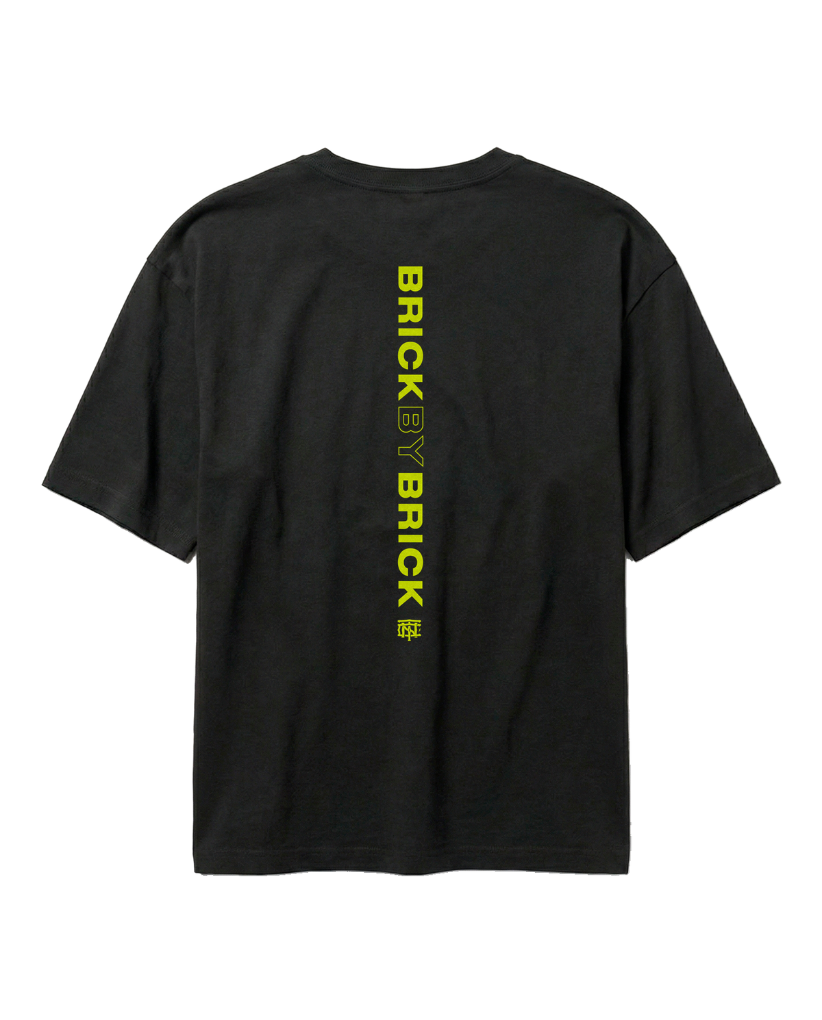 Brick by Brick oversize t-shirt in black — back with BRICK BY BRICK set vertically down the centre in lime green — View 1
