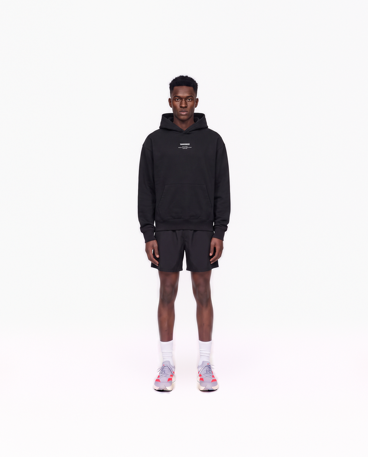 Model wearing the Today Was My Rest Day oversize hoodie in black — front view with the compact Thundernoise chest mark in white — View 2
