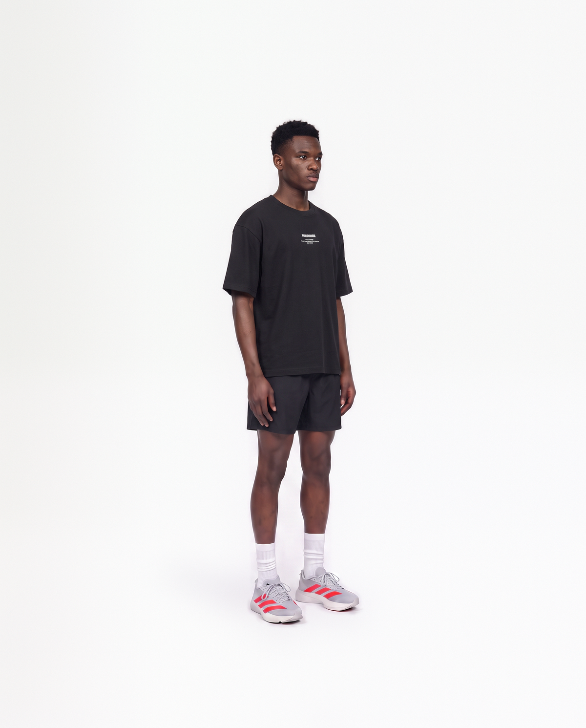 Model wearing the Today Was My Rest Day oversize t-shirt in black — three-quarter view showing the oversize fit — View 3
