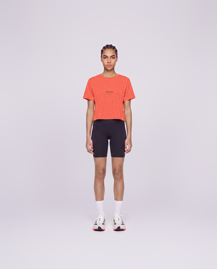 Training Dept. triblend cropped t-shirt in coral on model — front view