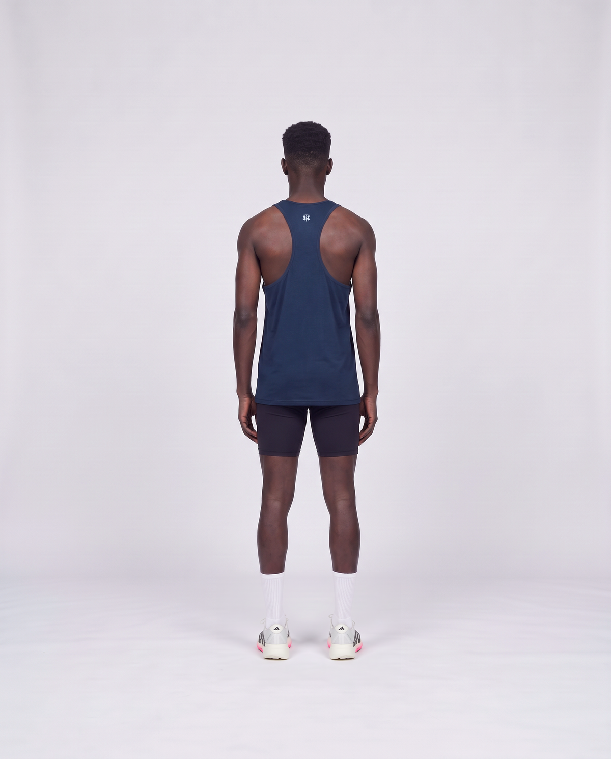Training Dept. triblend tank top in french navy heather on model — back view — View 4
