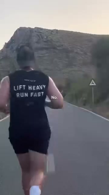 Black Lift Heavy Run Fast tank, seen from behind on a runner